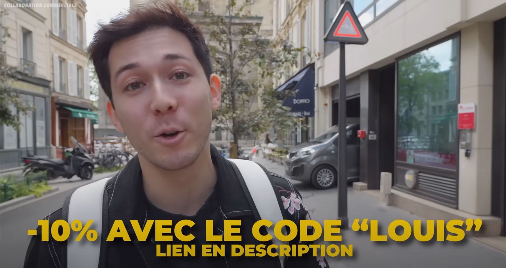 Louis San dans une rue parle de sa collaboration commerciale avec une marque